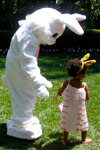 Blue Ivy holds hands with the Easter Bunny
