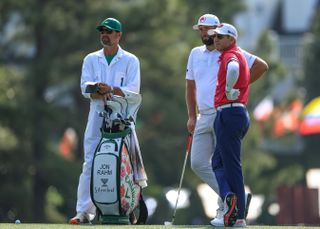 Jon Rahm and his caddie at The Masters