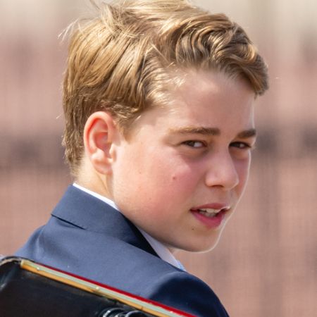 Prince George wears a navy suit to attend Trooping the Colour 2026 and has floppy dark blonde hair