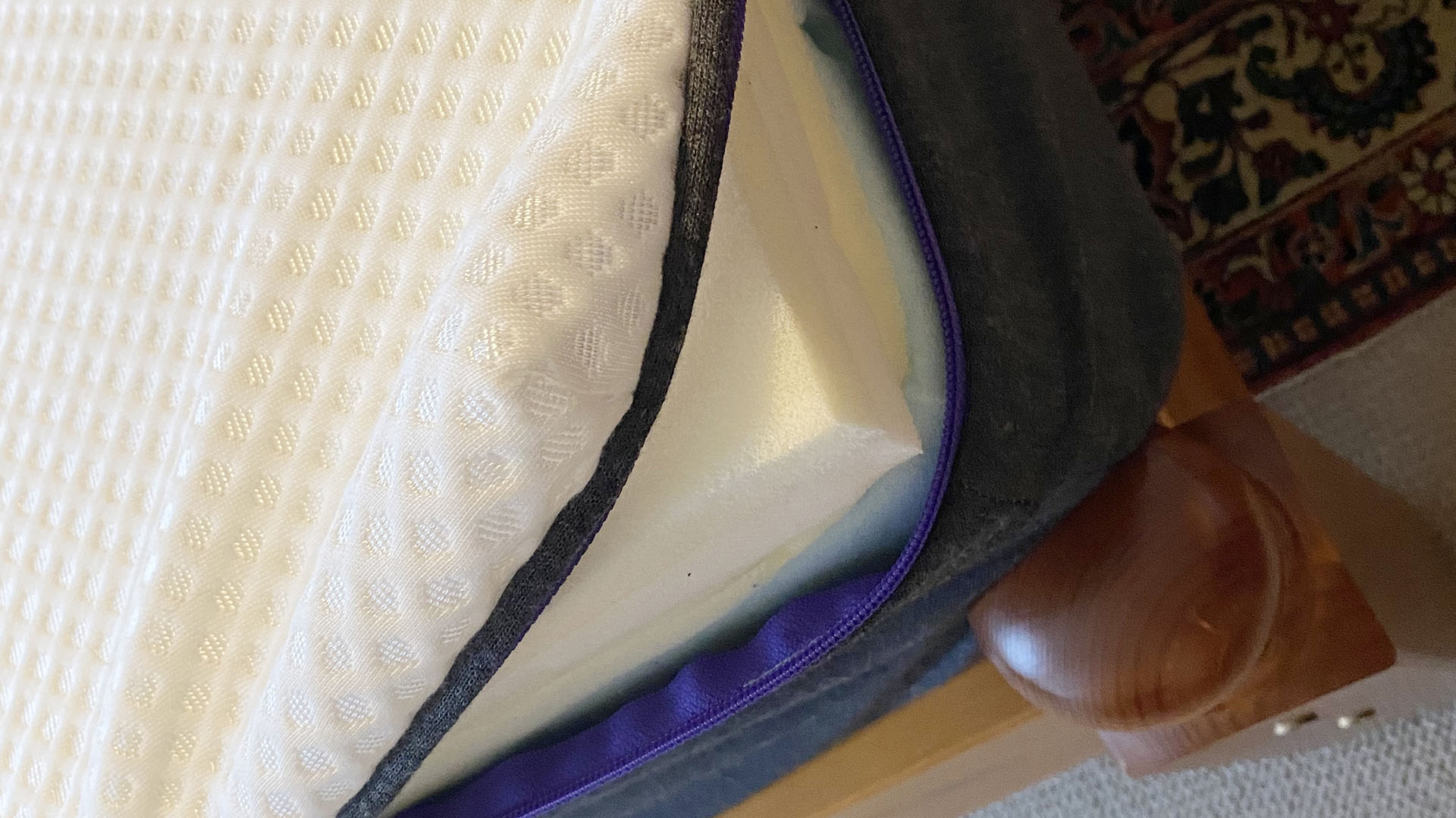 Nectar Premier Hybrid mattress unzipped to show foams inside