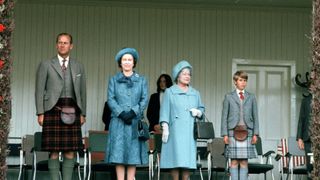 Prince Philip, the Duke of Edinburgh, Queen Elizabeth II, the Queen Mother and Prince Charles attend the Braemar Gathering and Highland Games in 1975, in Braemar, Scotland. (Photo by Anwar Hussein/Getty Images)