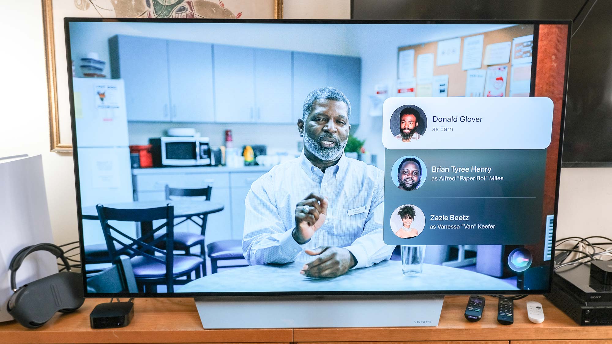 An episode of Atlanta, with a cast-list overlay, is playing on a TV connected to the Apple TV 4K (2022)