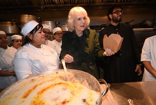 King Charles III and Queen Camilla meet British Muslim women at a female led restaurant and help pack donation boxes ahead of Ramadan, at Darjeeling Express, Kingly Court, Carnaby Street on February 26, 2025 in London, England