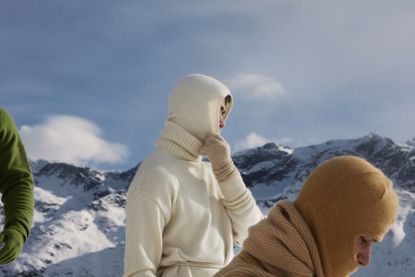 Men in Extreme Cashmere knitwear and balaclavas on snowy slopes of St Moritz