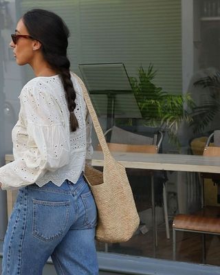 Influencer wears a broderie anglaise blouse.