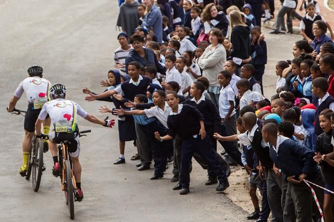Local school children encourage riders