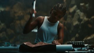 Riri Williams hammering out a heart in the Black Panther: Wakanda Forever trailer.