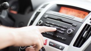 Man controlling in-car entertainment
