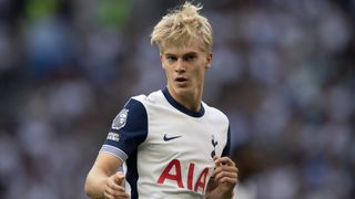 Lucas Bergvall of Tottenham Hotspur, with blond hair, runs the pitch ahead of the Ferencvaros vs Tottenham Europa League clash