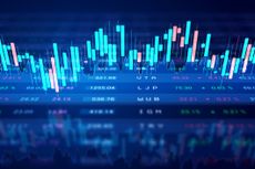 Stock price chart on trading board to illustrate investing concept