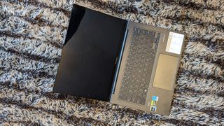 Asus Zenbook 14X OLED laptop on carpet