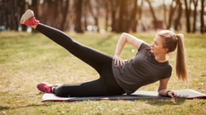 Woman doing side leg raises on the floor