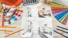Table woth house renovation drawings next to pencils, colour charts and a calculator to plan accordingly to avoid home renovation mistakes