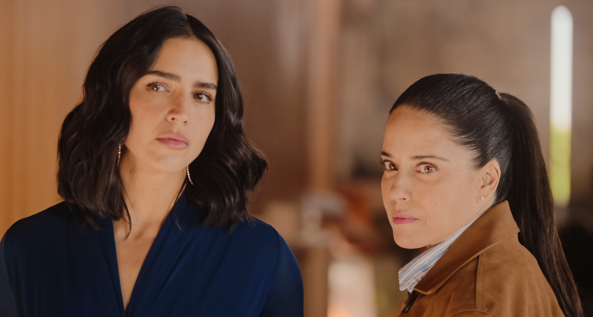 two women look suspicious in a still from the netflix soap the accident season 2
