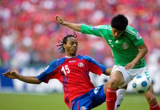Mexico's Ricardo Osorio competes for the ball with Costa Rica's Armando Alonso in a World Cup qualifier in March 2009.