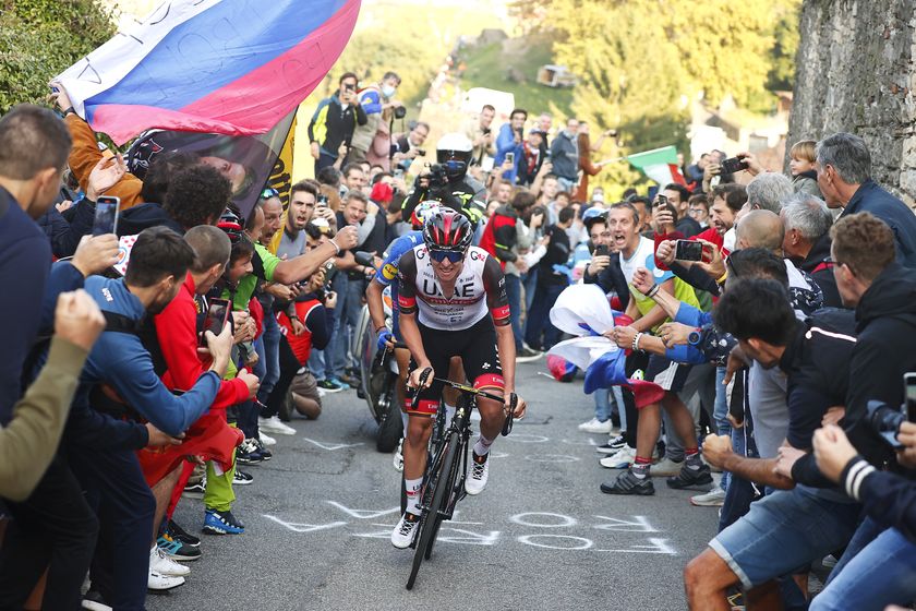BERGAMO, ITALY - OCTOBER 09: Tadej Pogacar of Slovenia and UAE Team Emirates competes in the breakaway while fans cheer during the 115th Il Lombardia 2021 a 239km race from Como to Bergamo / #ilombardia / #UCIWT / on October 09, 2021 in Bergamo, Italy. (Photo by Luca Bettini - Pool/Getty Images)