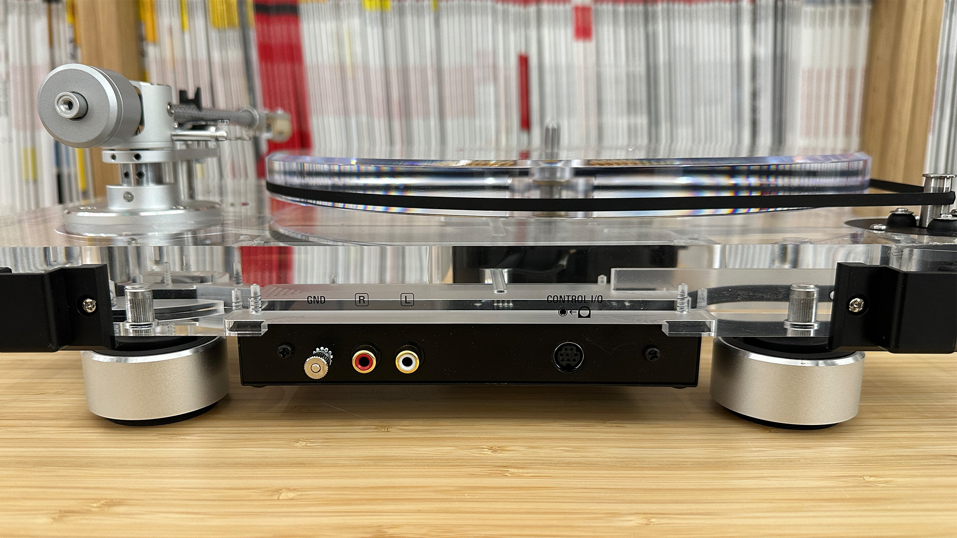 Audio-Technica AT-LPA2 turntable in front of bookcase, rear of turntable showing connections