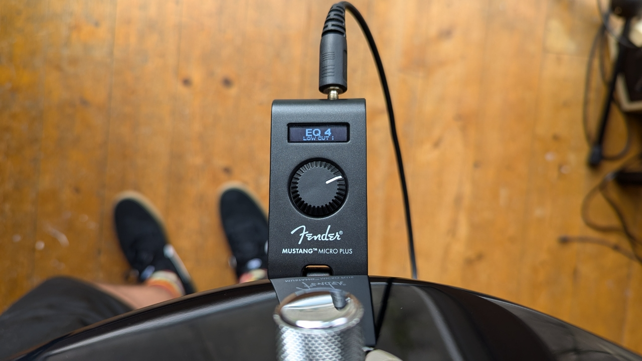 A Fender Mustang Micro Plus headphone guitar amp plugged into a Telecaster guitar