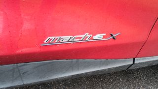 ford mustang mach-e logo in red