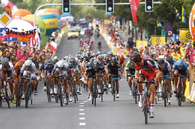 Taylor Phinney holds off the chasing pack to win a stage in Poland