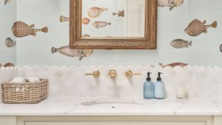 mosaic wall tiles and wall-mounted taps