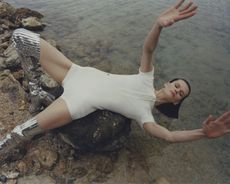 Best swimwear brands for men and women, showing woman lying in swimsuit on beach