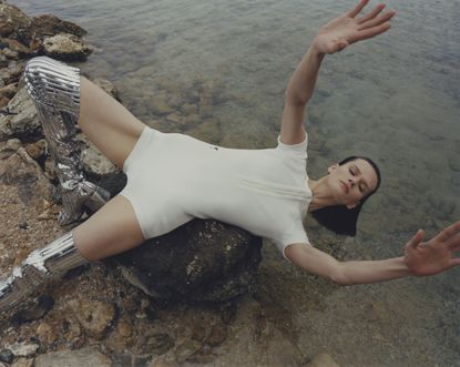 Best swimwear brands for men and women, showing woman lying in swimsuit on beach