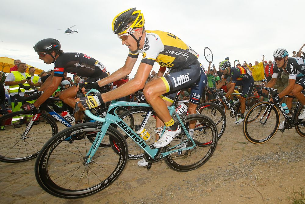 Robert Gesink hangs on over the cobbles during stage 4.