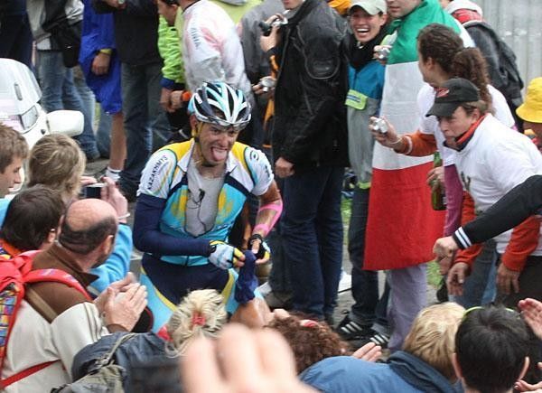 Antonio Colom (Astana) stops to bundle up on the Mortirolo.