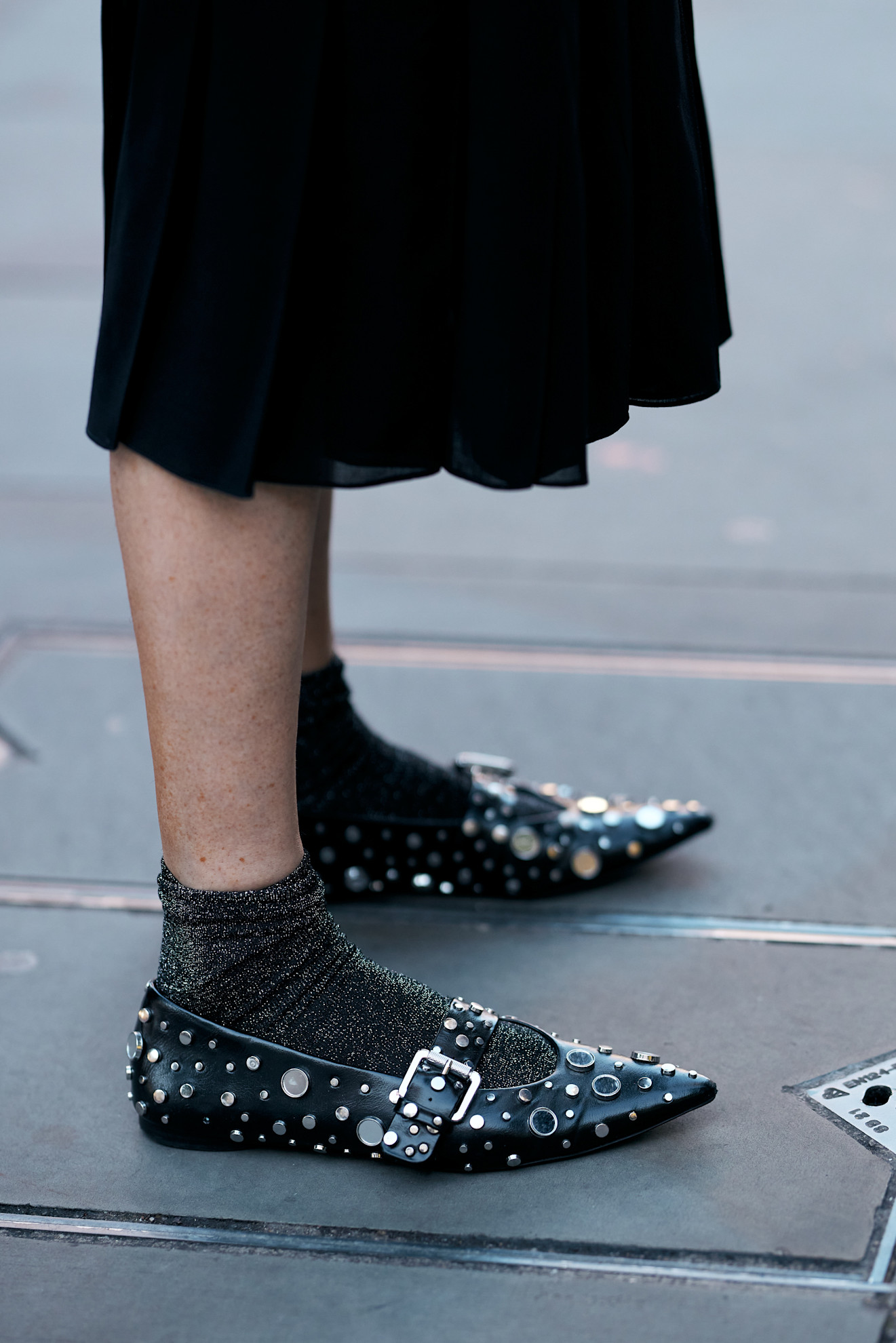 womajn wearing buckled flats in London