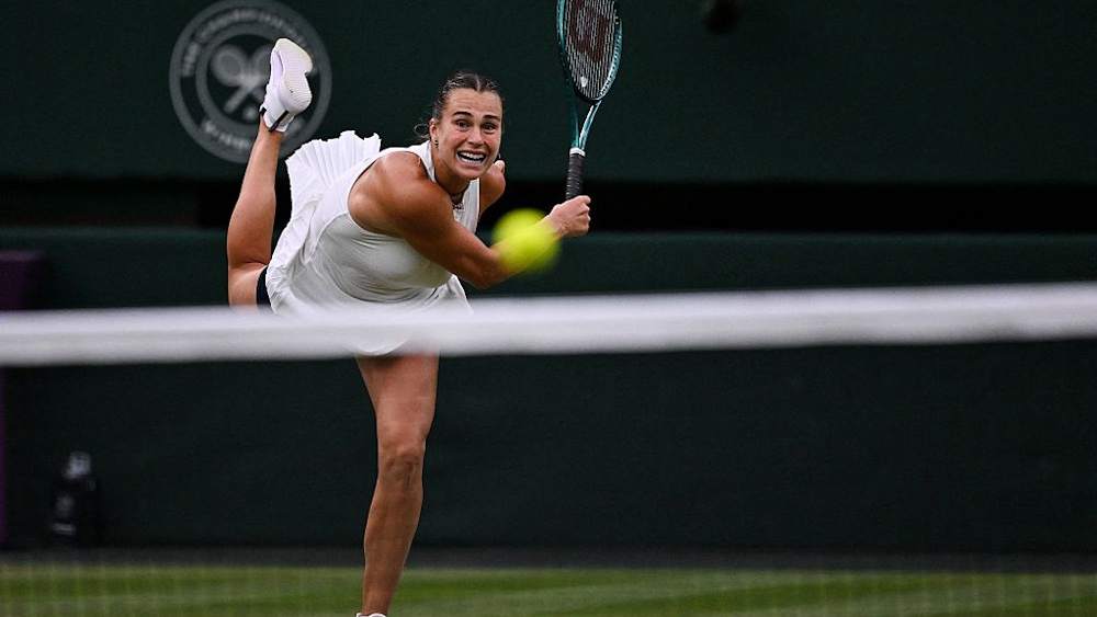 Aryna Sabalenka serves during a match at Wimbledon 2025.