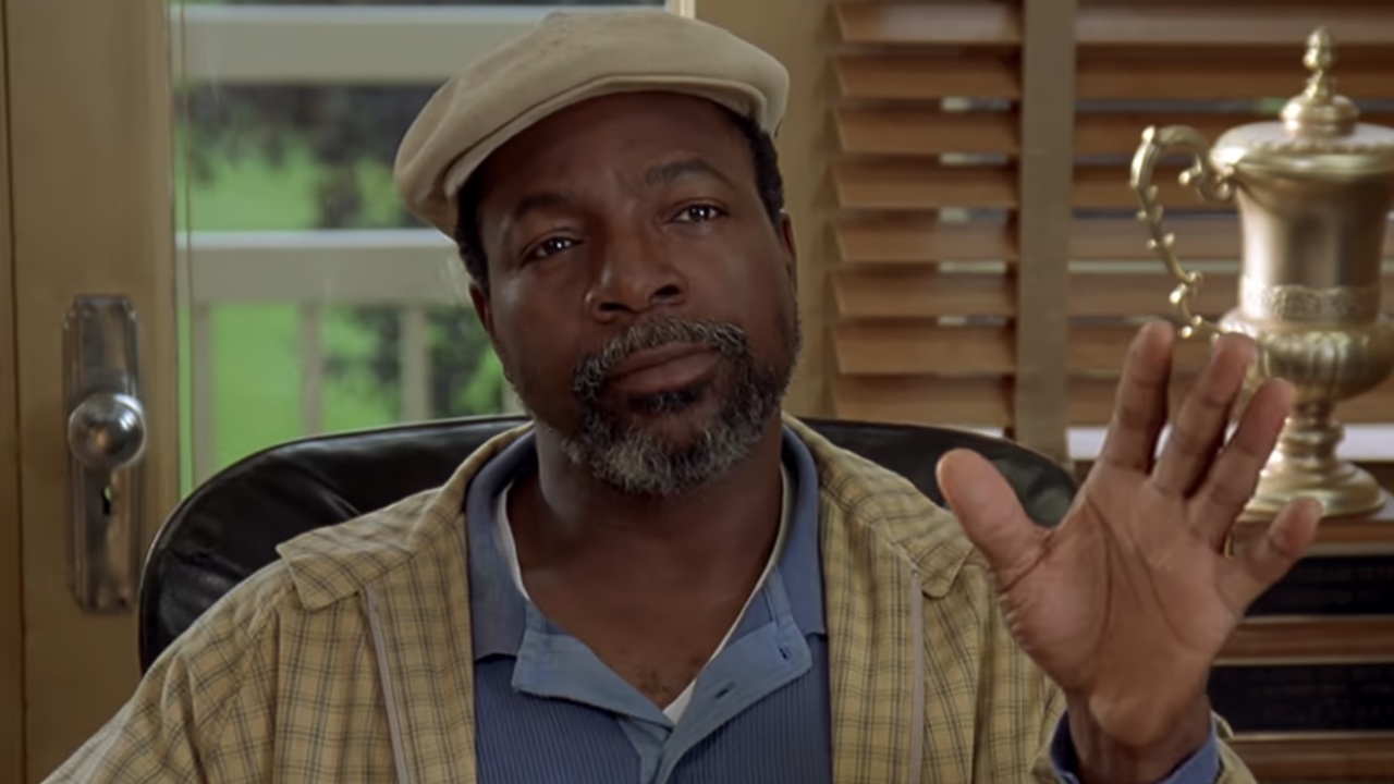 Carl Weathers in his office during Happy Gilmore 