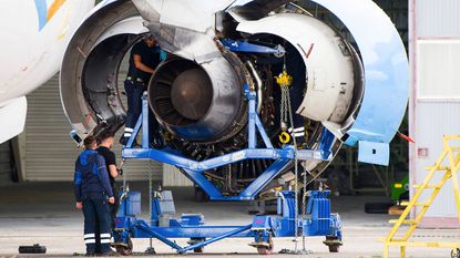 Rolls-Royce engineers working on an aircraft engine © Nathan Laine/Bloomberg via Getty Images