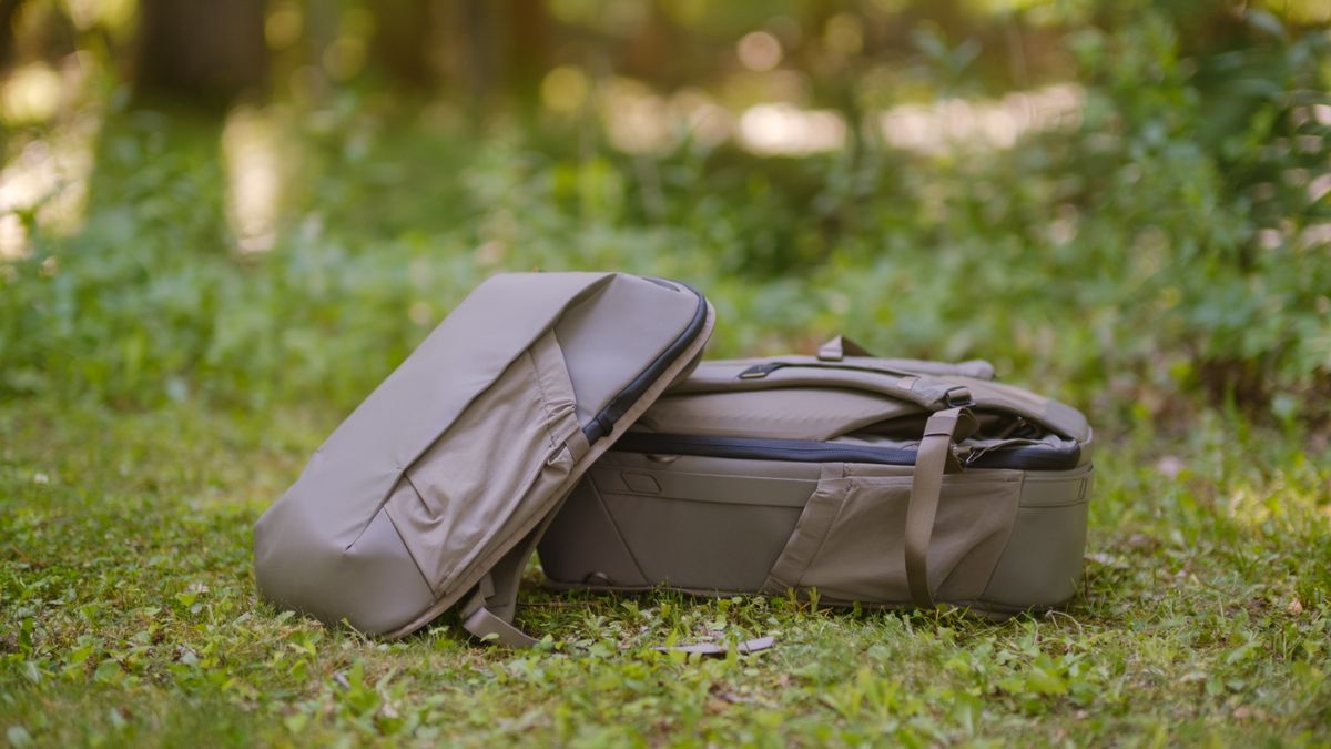 The Peak Design Travel 2-in-1 Backpack outdoors used by a photographer