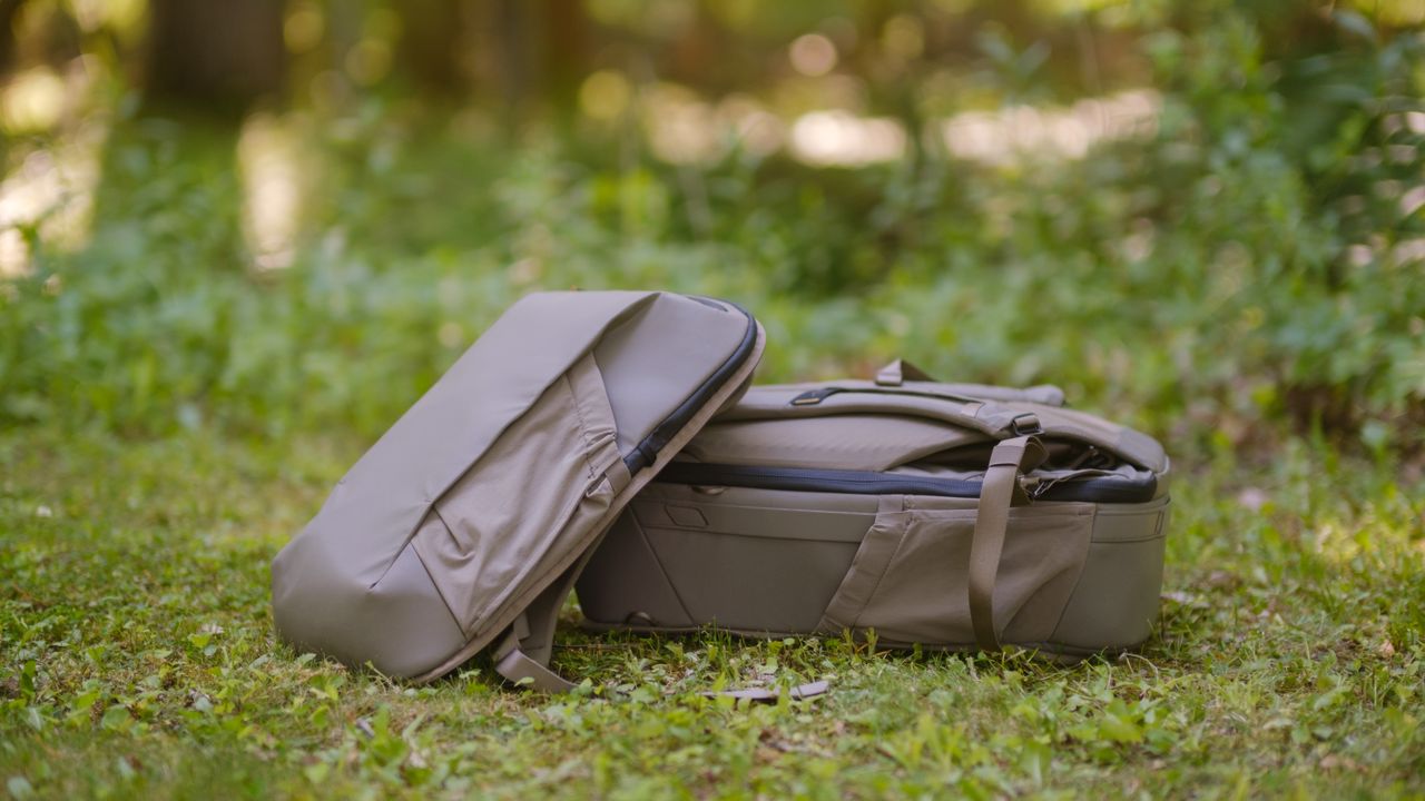 The Peak Design Travel 2-in-1 Backpack outdoors used by a photographer