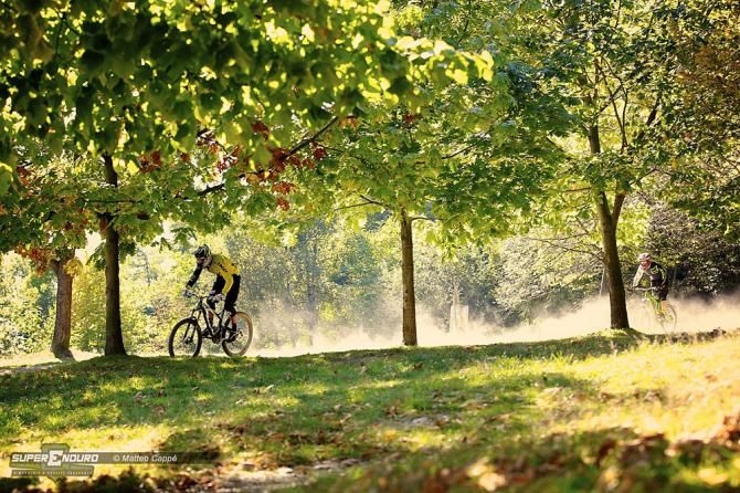 Riders fly down the enduro course