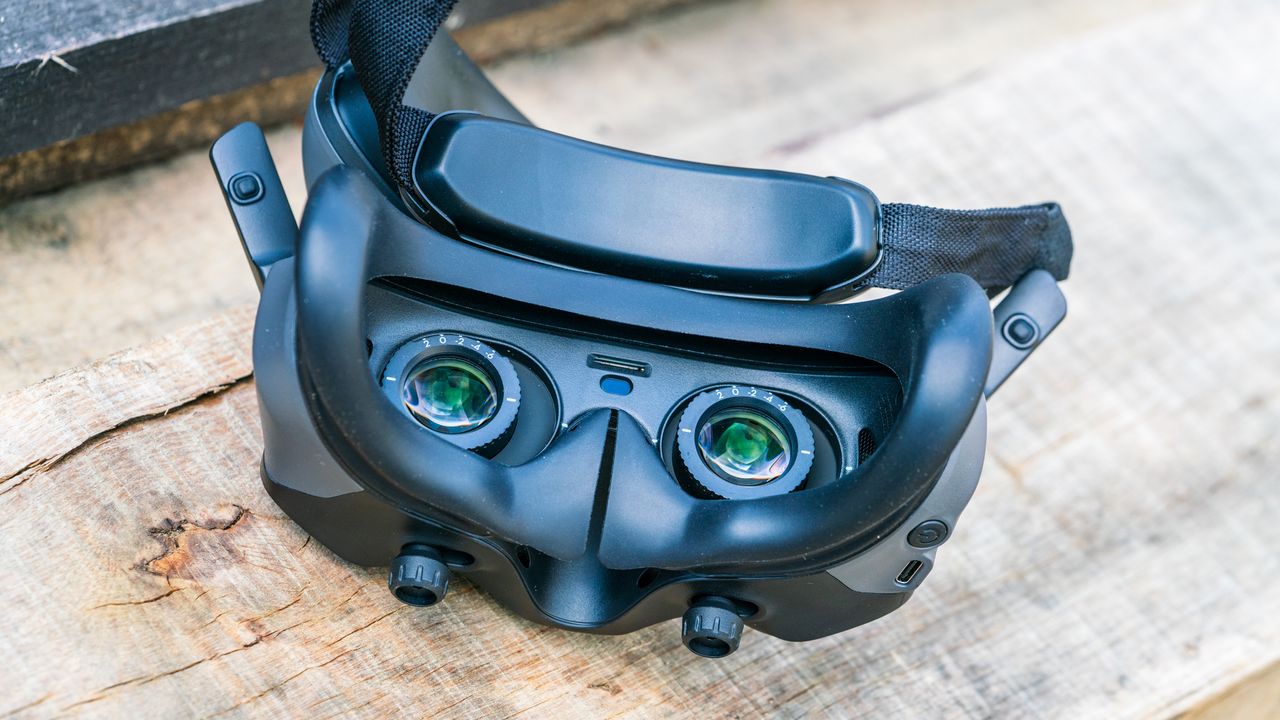 DJI Avata 2 FPV drone goggles on a wooden bench