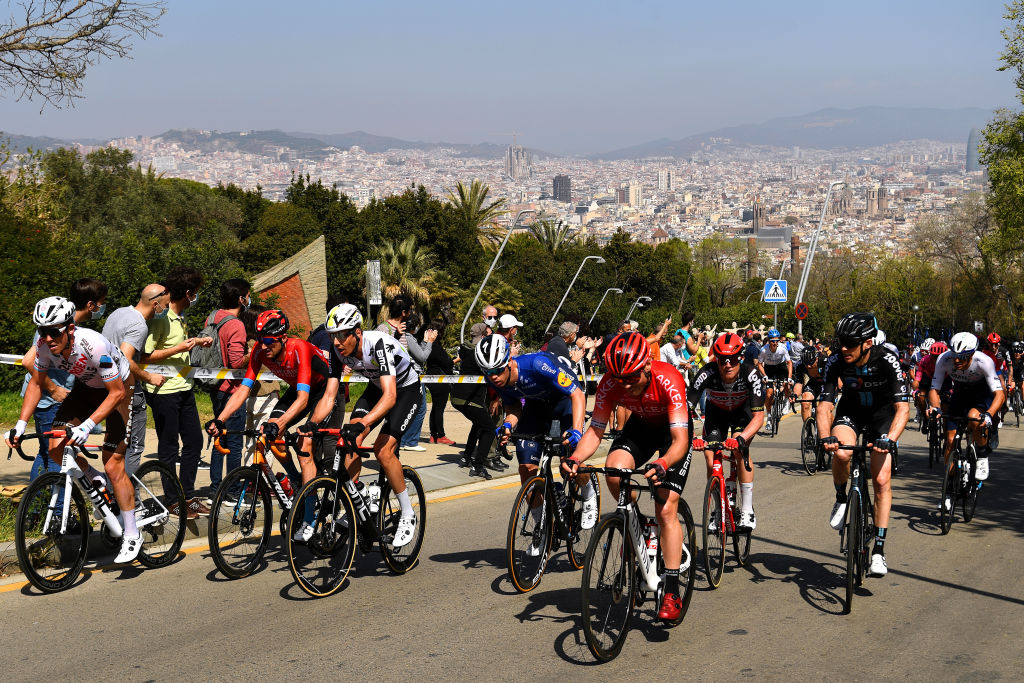 BARCELONA SPAIN  MARCH 28 Bob Jungels of Luxembourg and Ag2R Citroen Team Wouter Poels of Netherlands and Team Bahrain Victorious  Kilian Frankiny of Switzerland and Team Qhubeka Assos Rmi Cavagna of France and Team Deceuninck  QuickStep  The peloton during the 100th Volta Ciclista a Catalunya 2021 Stage 7 a 133km stage from Barcelona to Barcelona  Public  Fans  Alt del Castell de Montjuc 170m  Landscape  VoltaCatalunya100  on March 28 2021 in Barcelona Spain Photo by David RamosGetty Images