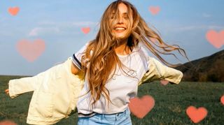 Woman dancing surrounded by love hearts