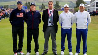 Photo of Jim Furyk and Hunter Mahan at the Ryder Cup against Rory McIlroy and Sergio Garcia