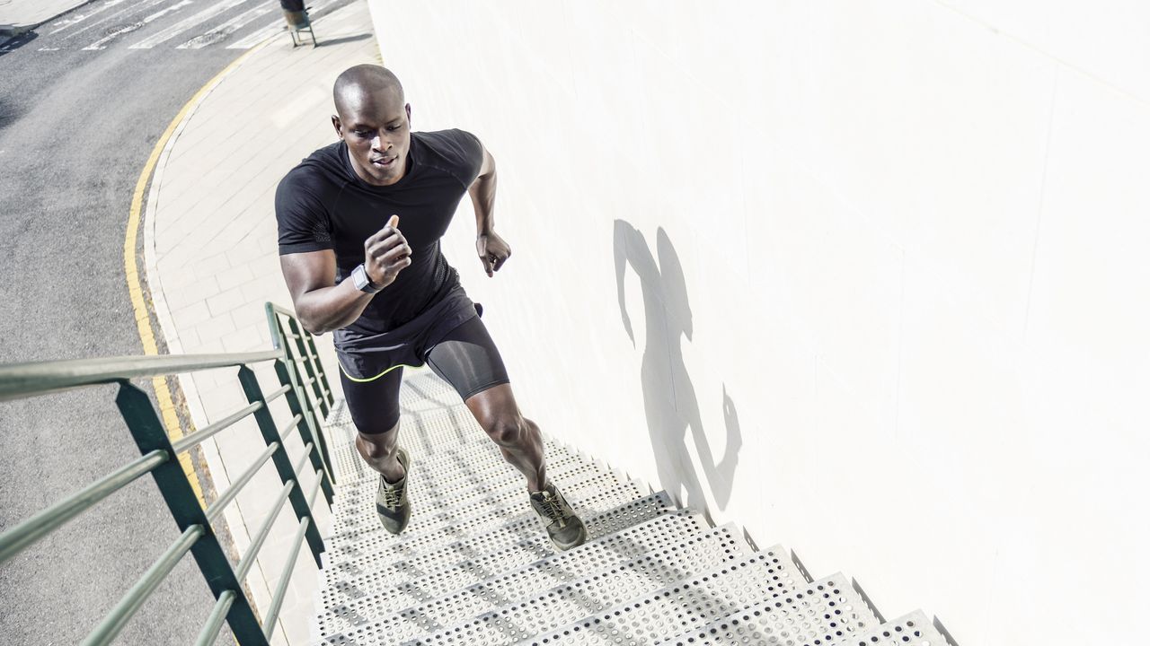 best running shorts: Pictured here an athlete running up some steps