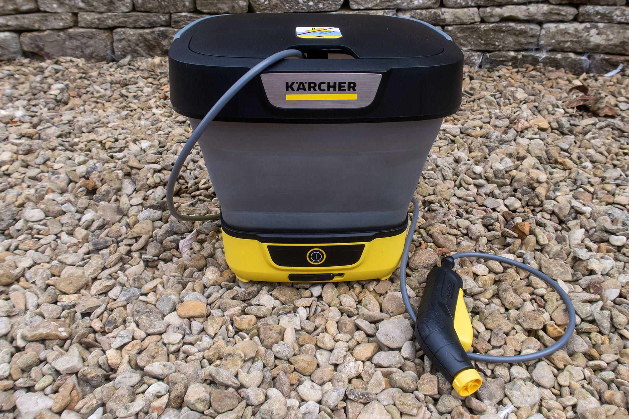 K&amp;auml;rcher Mobile Cleaner OC 3 Foldable pictured on gravel.
