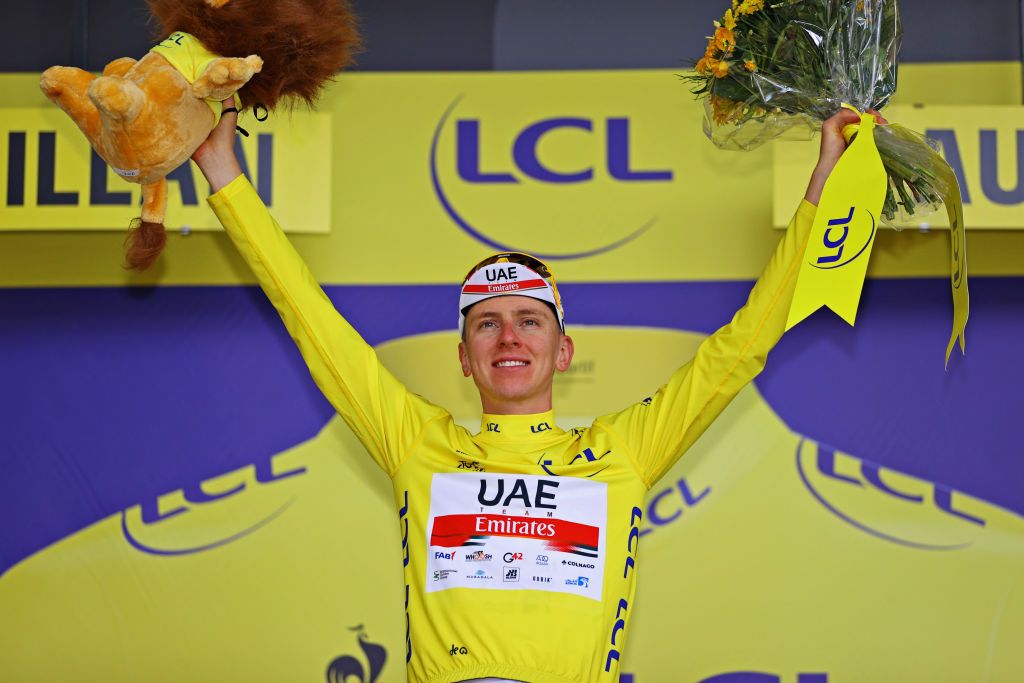 QUILLAN FRANCE JULY 10 Tadej Pogaar of Slovenia and UAETeam Emirates Yellow Leader Jersey celebrates at podium during the 108th Tour de France 2021 Stage 14 a 1837km stage from Carcassonne to Quillan Lion Mascot LeTour TDF2021 on July 10 2021 in Quillan France Photo by Tim de WaeleGetty Images