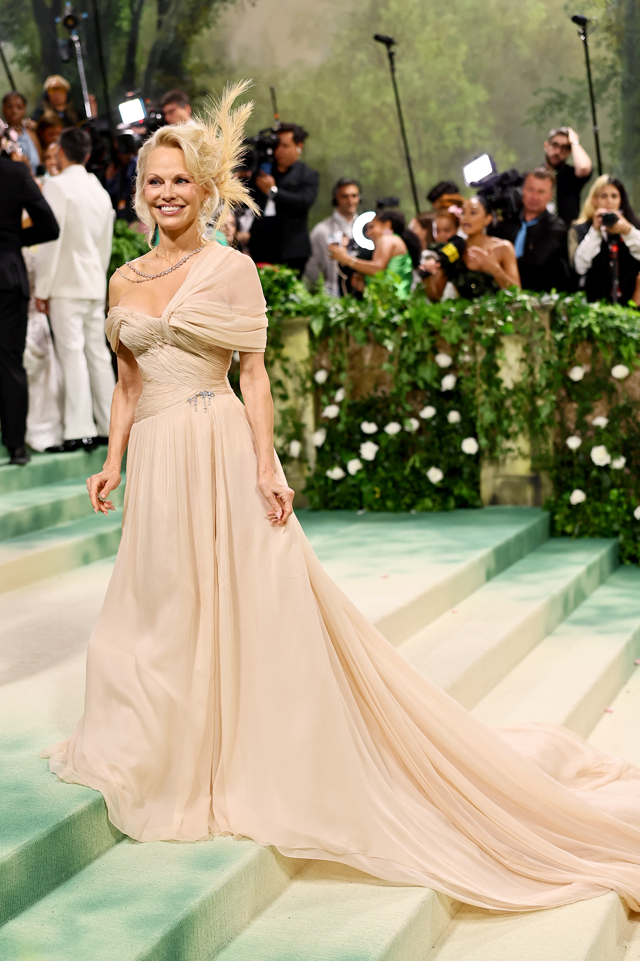 Pamela Anderson wears a nude Oscar de la Renta dress at the 2024 Met Gala