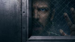 The Terror: Devil in Silver key art. Dan Stevens as Pepper with his face and hand against the glass of a cell door trying to get out.
