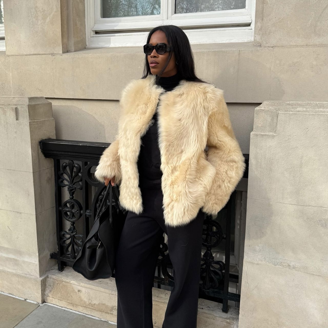 Marilyn NK in a cream faux fur jacket