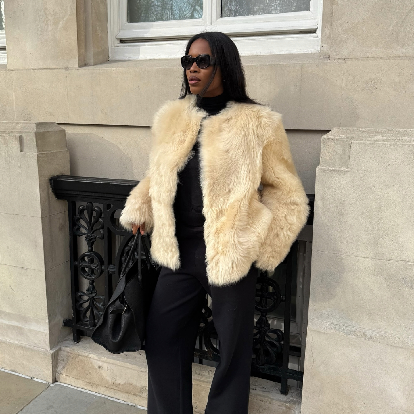 Marilyn NK in a cream faux fur jacket