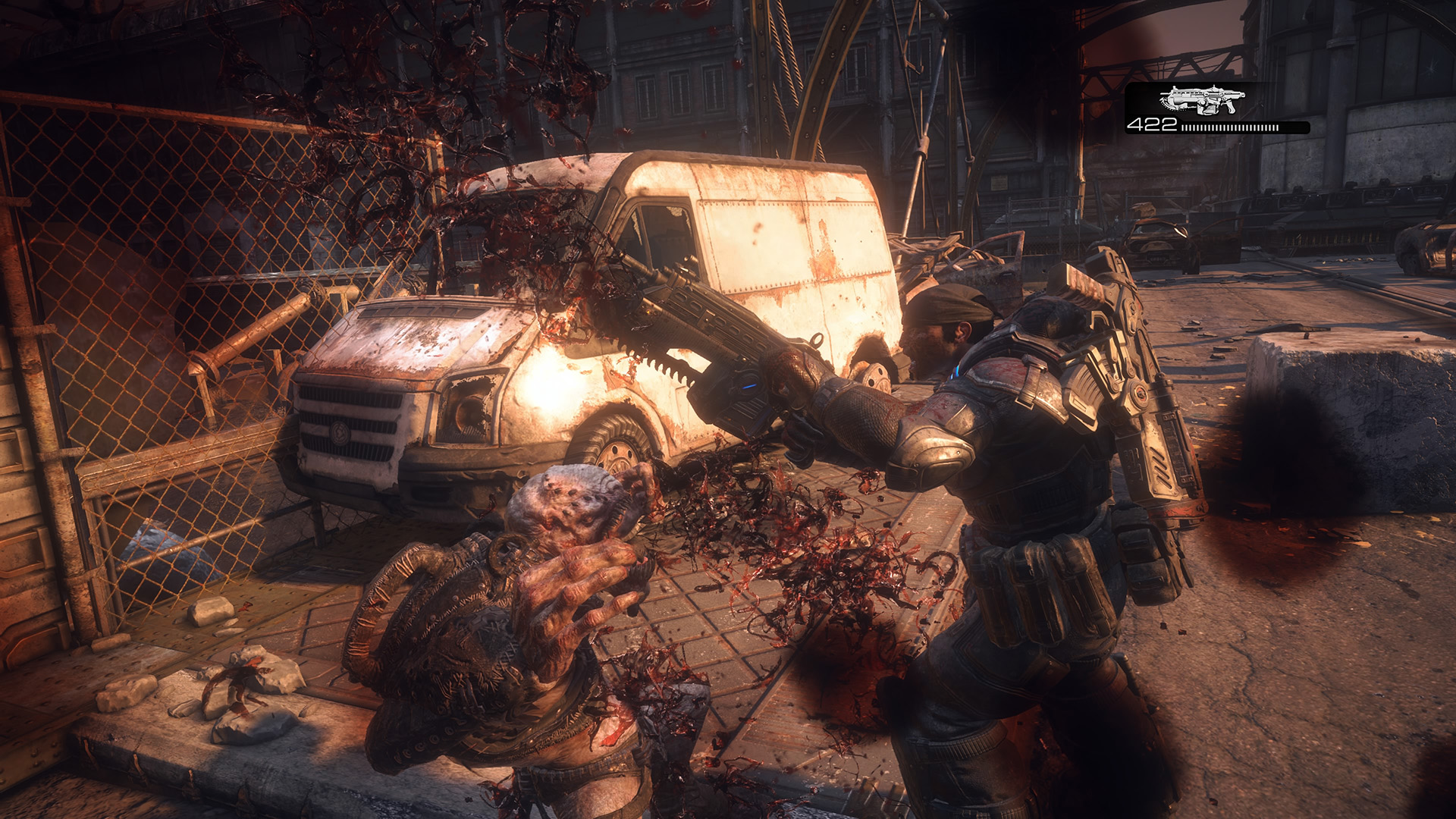 Marcus chainsaws an enemy in Gears of War: Reloaded