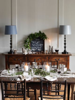 Rustic Christmas table with evergreen and candles