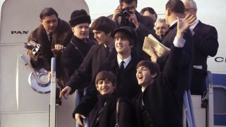 Image taken from Beatles '64 showing The Beatles disembarking from their plane at Kennedy Airport in February 1964